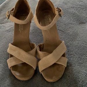 Beige canvas Tom’s wedges with cork heal, worn just a couple times.